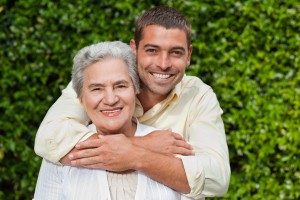 Man hugging his mother in the garden